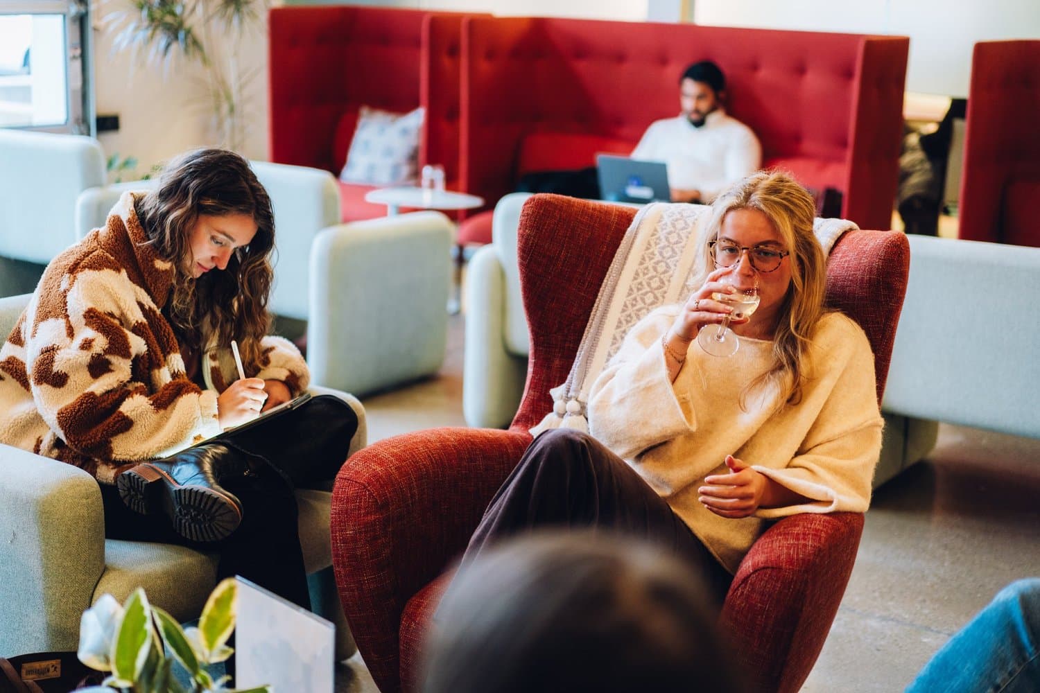 Story Louisville members collaborating in the lounge